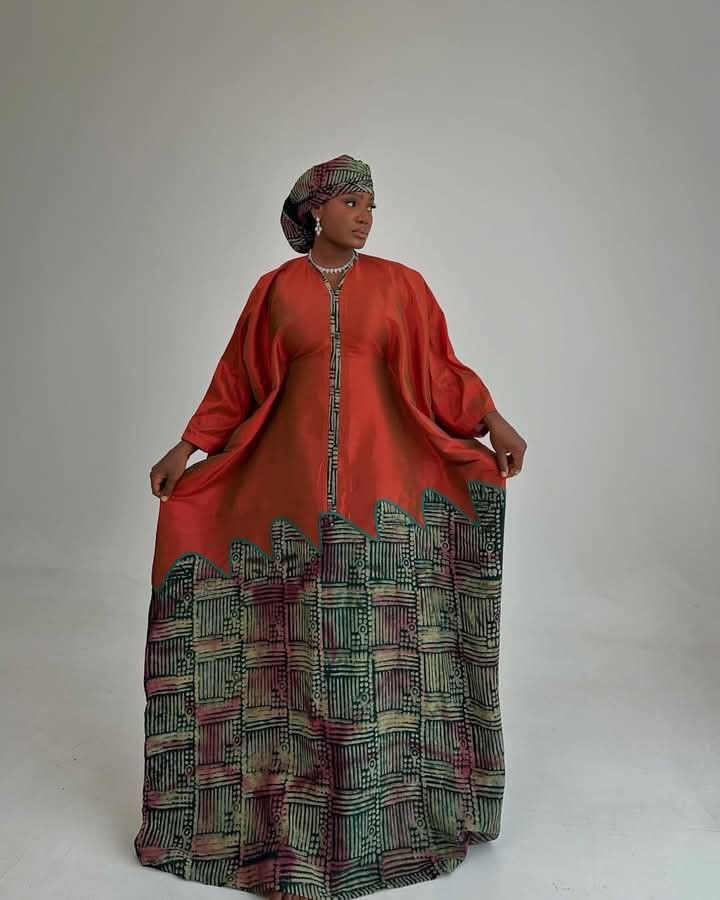 Model in terracotta adire wide-sleeve gown — Elegant Fashion Palace